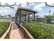 Boat lift and dock with a covered area over the boat slip at 633 Soundview Dr, Palm Harbor, FL 34683