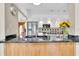 Modern kitchen with stainless steel appliances, granite countertops, and stylish pendant lighting at 633 Soundview Dr, Palm Harbor, FL 34683