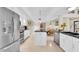 Spacious kitchen with stainless steel appliances, an island, and an open layout to the dining area at 633 Soundview Dr, Palm Harbor, FL 34683