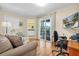 Comfortable living room with natural lighting and sliding glass doors leading to the outside at 633 Soundview Dr, Palm Harbor, FL 34683