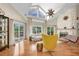 Bright living room with views of the yard, a stone fireplace, and modern decor at 633 Soundview Dr, Palm Harbor, FL 34683