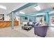 Open-concept living room featuring a bar area and stylish furniture at 633 Soundview Dr, Palm Harbor, FL 34683