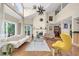 Bright living room boasts vaulted ceilings, stone fireplace, and modern furnishings at 633 Soundview Dr, Palm Harbor, FL 34683