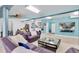 Spacious living room with tile floors, entertainment center, and unique nautical decor at 633 Soundview Dr, Palm Harbor, FL 34683