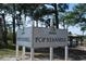 Sign for Pop Stansell Park, Palm Harbor, featuring lush trees and a clear sky at 633 Soundview Dr, Palm Harbor, FL 34683