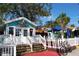 Charming restaurant exterior with colorful accents, outdoor seating, and a welcoming entrance at 633 Soundview Dr, Palm Harbor, FL 34683