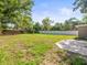Spacious backyard with well-maintained grass and a concrete patio at 6627 Main St, New Port Richey, FL 34653
