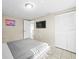 Comfortable bedroom features a closet, tv, and serene decor for a relaxing retreat at 6627 Main St, New Port Richey, FL 34653