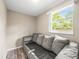 This bonus room has hardwood floors and a window that brings in tons of natural light at 6627 Main St, New Port Richey, FL 34653