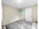 Neutral bedroom featuring a comfortable bed and a charming piece of artwork at 6627 Main St, New Port Richey, FL 34653