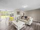Spacious living area seamlessly connected to the kitchen and dining space, ideal for modern living at 6627 Main St, New Port Richey, FL 34653