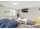Comfortable living room with a large window, modern furnishings, and stylish decor at 6627 Main St, New Port Richey, FL 34653
