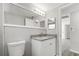 Updated bathroom with granite countertop vanity, new fixtures, and modern finishes at 7926 Gulf Way, Hudson, FL 34667