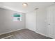 Cozy bedroom featuring new flooring, natural light, and a spacious closet at 7926 Gulf Way, Hudson, FL 34667