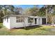 Well-maintained home featuring a freshly painted exterior, manicured landscaping, and an attached one-car garage at 7926 Gulf Way, Hudson, FL 34667