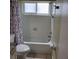 Clean bathroom with a bathtub, shower, and white tile walls and a floral shower curtain at 9035 37Th N St, Pinellas Park, FL 33782