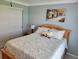 Bright bedroom with a ceiling fan, window with blinds and a closet with sliding doors at 9035 37Th N St, Pinellas Park, FL 33782