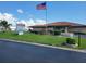 Exterior shot of the 'Mainlands 6' community building, featuring landscaping and signage at 9035 37Th N St, Pinellas Park, FL 33782