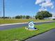 Inviting community entrance sign with a view of the well-manicured lawns and community homes at 9035 37Th N St, Pinellas Park, FL 33782