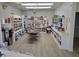 Community library with an extensive collection of books, table, and comfortable seating at 9035 37Th N St, Pinellas Park, FL 33782