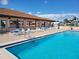 Resort style community pool with lounge seating offering a relaxing oasis at 9035 37Th N St, Pinellas Park, FL 33782