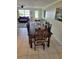 Cozy dining area with a wooden table, views of the living room, and plenty of natural light at 9035 37Th N St, Pinellas Park, FL 33782