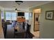 Open-concept dining room with a large table and chairs, flowing into the living area at 9035 37Th N St, Pinellas Park, FL 33782