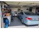 Spacious two-car garage with ample storage, laundry appliances, and a car, offering functionality at 9035 37Th N St, Pinellas Park, FL 33782