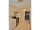 Well-lit kitchen featuring white cabinets, stainless steel appliances, and an open layout at 9035 37Th N St, Pinellas Park, FL 33782