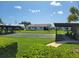 Community lawn bowling with covered seating areas surrounded by lush lawns and well-maintained landscaping at 9035 37Th N St, Pinellas Park, FL 33782