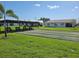 Community lawn bowling area with covered seating and picturesque landscaping at 9035 37Th N St, Pinellas Park, FL 33782