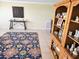 Spacious room with a beautiful area rug and a wooden china cabinet at 9035 37Th N St, Pinellas Park, FL 33782