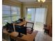 Bright office space with a large desk area, natural light, and sliding glass doors at 9035 37Th N St, Pinellas Park, FL 33782
