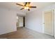 Bedroom featuring carpet floors, a ceiling fan, and access to the ensuite bathroom and closets at 9100 Dr Martin Luther King Jr N St # 1204, St Petersburg, FL 33702