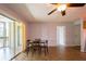 The dining area has tile floors, a ceiling fan and sliding glass doors to the screened porch at 9100 Dr Martin Luther King Jr N St # 1204, St Petersburg, FL 33702