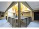 Exterior entrance featuring an exterior hall with metal railings overlooking greenery below at 9100 Dr Martin Luther King Jr N St # 1204, St Petersburg, FL 33702