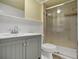Updated bathroom featuring a glass-enclosed shower, modern vanity, and clean, contemporary design at 9132 Mango St, New Port Richey, FL 34654
