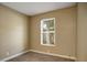 Bedroom with neutral colors, window and electrical outlets at 9132 Mango St, New Port Richey, FL 34654