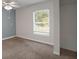 Bedroom featuring a window and closet space providing natural light and storage solutions at 9132 Mango St, New Port Richey, FL 34654
