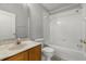 Bathroom with a tub and shower combo, marble countertops, and white cabinets at 9818 White Barn Way, Riverview, FL 33569