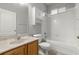 Bathroom with a tub and shower combo, marble countertops, and white cabinets at 9818 White Barn Way, Riverview, FL 33569