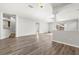 Spacious living room boasting wood floors, natural light, and seamless flow to other areas at 9818 White Barn Way, Riverview, FL 33569