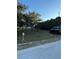 Large front yard featuring mature trees and minimal landscaping at 9900 Ideal Ln, Hudson, FL 34667