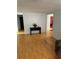Spacious living room with laminate flooring and a glimpse of other rooms at 9900 Ideal Ln, Hudson, FL 34667