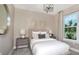 Comfortable bedroom featuring neutral tones, decorative wall art, and lots of natural light at 9970 Trellis Vine Way, Parrish, FL 34219