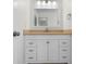 Clean bathroom with a white vanity, modern fixtures, and a well-lit mirror, offering a refreshing space at 1002 Strawpocket Pl, Sun City Center, FL 33573