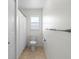 Functional bathroom with a shower-tub combo, neutral tile flooring, and ample natural light, creating a practical space at 1002 Strawpocket Pl, Sun City Center, FL 33573