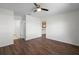 Spacious bedroom with laminate flooring, a ceiling fan, and natural light, creating a serene retreat at 1002 Strawpocket Pl, Sun City Center, FL 33573