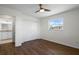 Cozy bedroom with laminate flooring, closet space, and a bright window, providing a comfortable and private area at 1002 Strawpocket Pl, Sun City Center, FL 33573