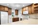 Charming kitchen with a combination of modern appliances and classic cabinetry, creating a warm and inviting atmosphere at 1002 Strawpocket Pl, Sun City Center, FL 33573